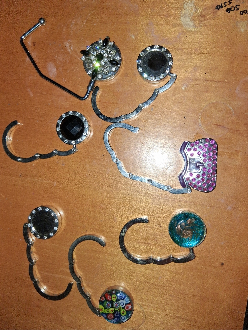 Seven vintage purse hooks